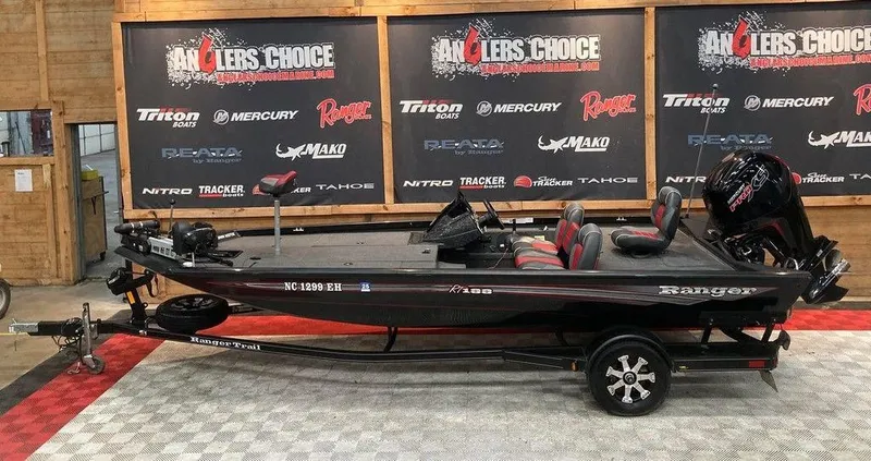 Slide: The Image of 2018 Ranger RT188 fishing boat displayed at Anglers Choice showroom with branded backdrop. - 1