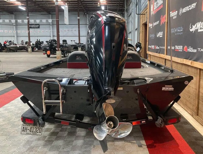 Slide: The Image of 2018 Ranger RT188 boat in showroom, rear view with motor and propeller. - 5