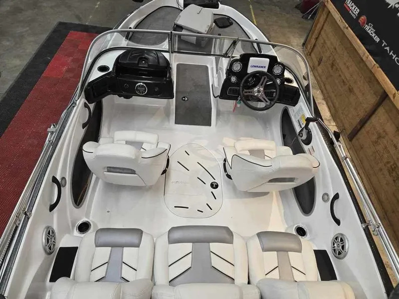 Slide: The Image of 2018 Nitro Z19 Sport boat interior with white seating and modern dashboard. - 5