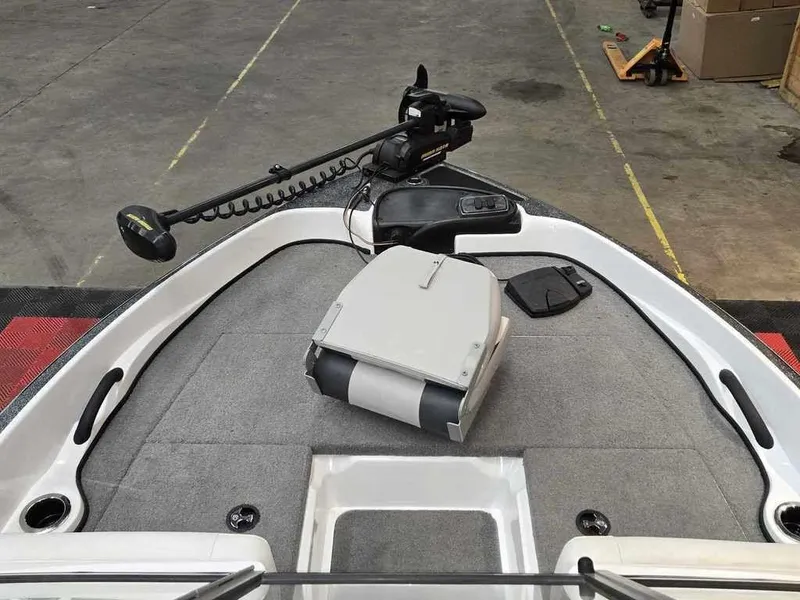 Slide: The Image of 2018 Nitro Z19 Sport boat deck with trolling motor and storage compartment. - 7