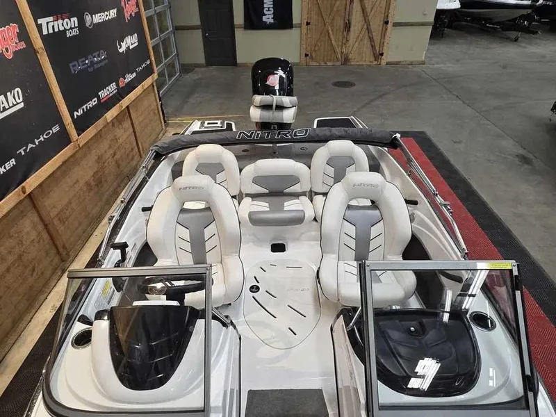 Slide: The Image of 2018 Nitro Z19 Sport boat with sleek seating and modern design in showroom. - 9