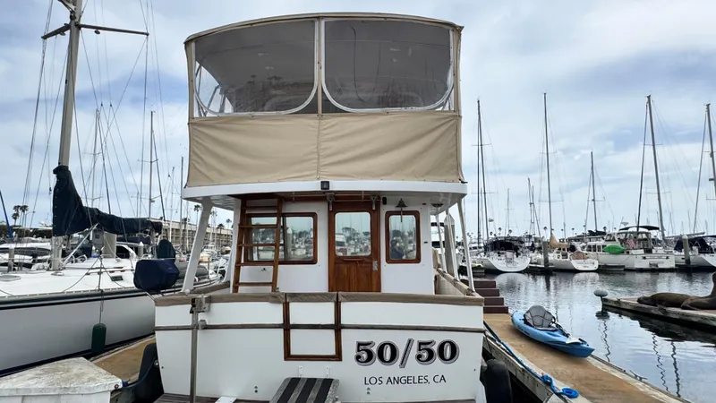 Slide: The Image of 1977 Marine Trader Europa boat docked in marina, Los Angeles, CA. - 2