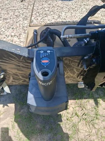 Slide: The Image of 2014 Lowe Stinger ST175 Camo boat with trolling motor, camo design visible. - 8