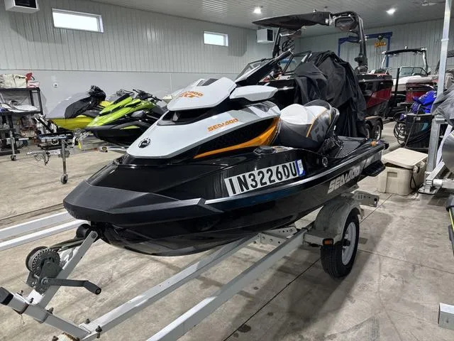 Slide: The Image of 2014 Sea-Doo Waverunner RXT on trailer in a garage setting. - 3