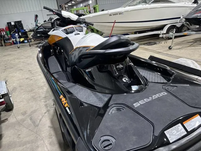 Slide: The Image of 2014 Sea-Doo Waverunner RXT in a garage, showcasing sleek design and features. - 4