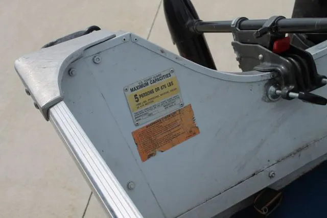 Slide: The Image of 1998 Smoker Craft BIG FISH boat capacity label, seating for five, close-up view. - 8