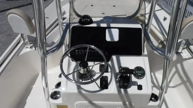 Slide: The Image of 2025 Bulls Bay 2200XS boat console with steering wheel and controls. - 11