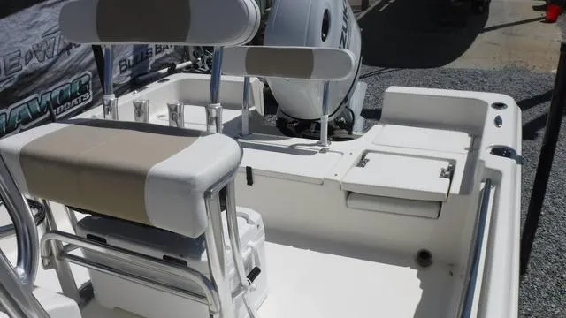 Slide: The Image of 2025 Bulls Bay 2200XS boat interior with seating and motor, showcasing modern design. - 7