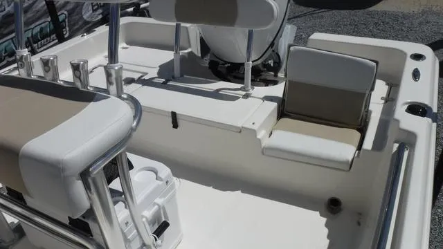 Slide: The Image of 2025 Bulls Bay 2200XS boat interior with seating and storage features. - 8