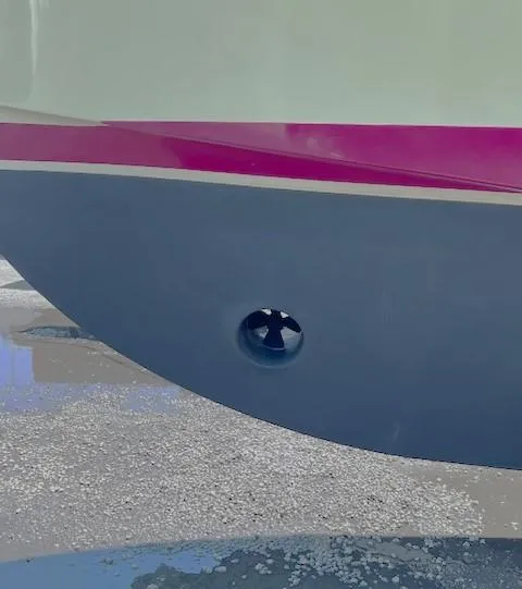 Slide: The Image of 2004 Mainship 30 Pilot Rum Runner boat hull with a visible thruster. - 26