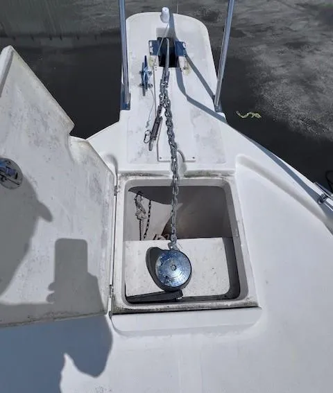 Slide: The Image of 2004 Mainship 30 Pilot Rum Runner anchor chain compartment on deck. - 28