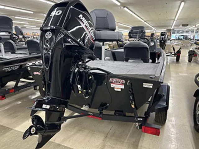 Slide: The Image of 2025 Tracker BASS TRACKER® Classic XL boat with Mercury engine displayed indoors. - 11