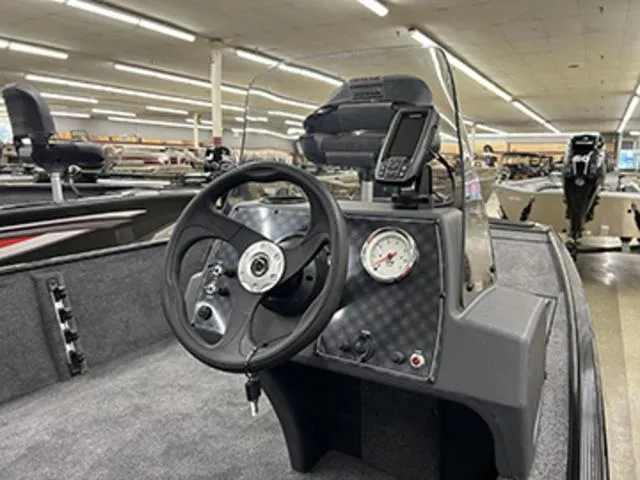 Slide: The Image of 2025 Tracker BASS TRACKER® Classic XL boat interior with steering wheel and dashboard display. - 4