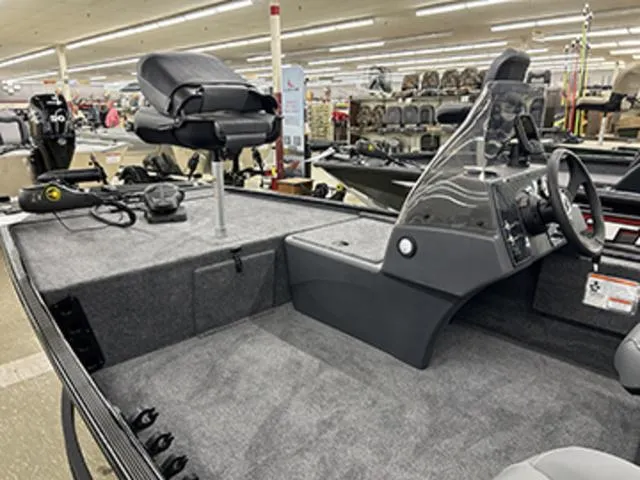 Slide: The Image of 2025 Tracker BASS TRACKER® Classic XL boat interior with seating and steering console. - 8