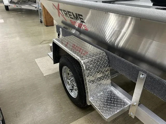Slide: The Image of 2025 XTREME BOATS River Skiff 1548SS trailer with diamond plate fender and wheel. - 6