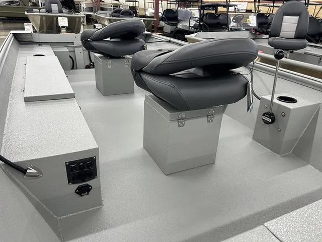 Slide: The Image of 2025 XTREME BOATS River Skiff 1548SS interior with seating and control panel. - 8