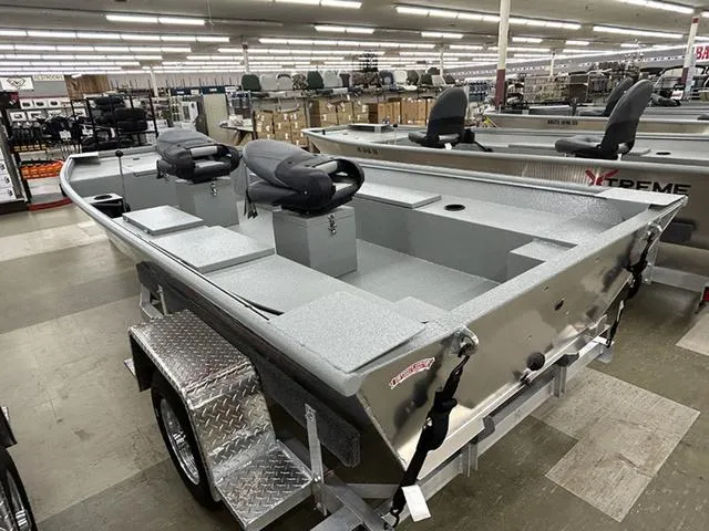 Slide: The Image of 2025 XTREME BOATS River Skiff 1548SS displayed in showroom, featuring sleek design and modern seating. - 9