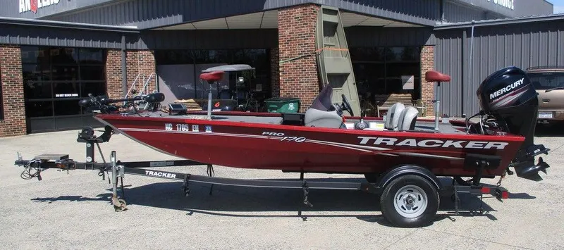The Image of 2018 Tracker Pro 170 boat on trailer, parked outside a building. - 1
