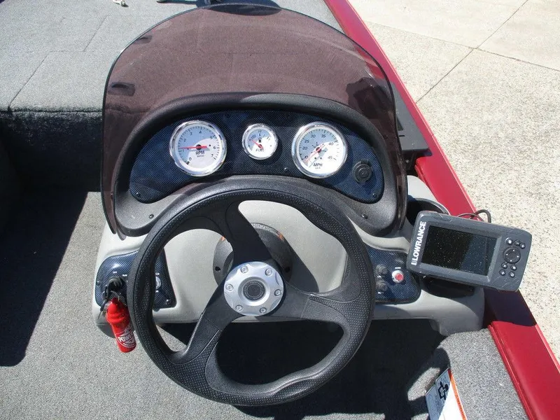 Slide: The Image of 2018 Tracker Pro 170 boat dashboard with steering wheel and gauges. - 4