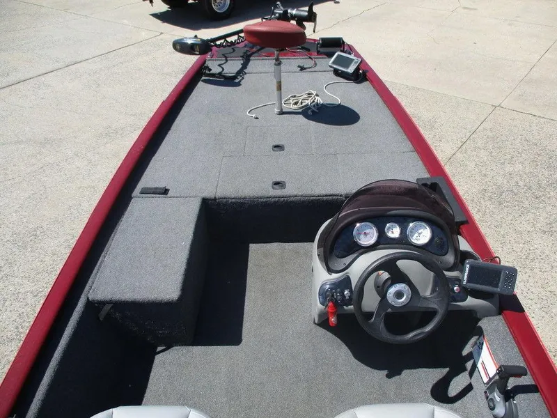 Slide: The Image of 2018 Tracker Pro 170 boat interior with steering console and fishing equipment. - 5