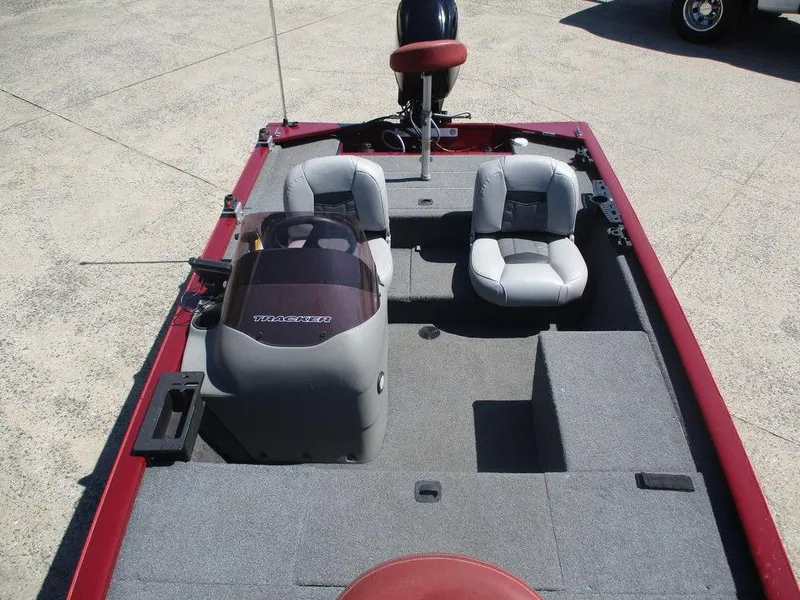 Slide: The Image of 2018 Tracker Pro 170 boat interior with two seats and steering console. - 7