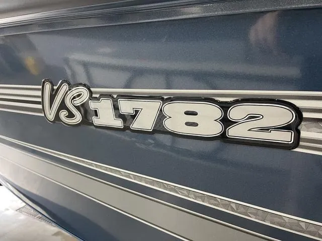 Slide: The Image of 2025 Ranger VS1782SC Angler boat model emblem on blue exterior. - 10