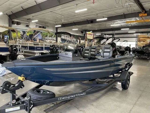 Slide: The Image of 2025 Ranger VS1782SC Angler boat in showroom, sleek design, on trailer. - 11