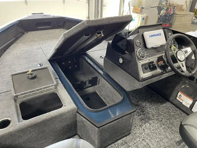 Slide: The Image of 2025 Ranger VS1782SC Angler boat interior with storage compartments and control panel. - 19