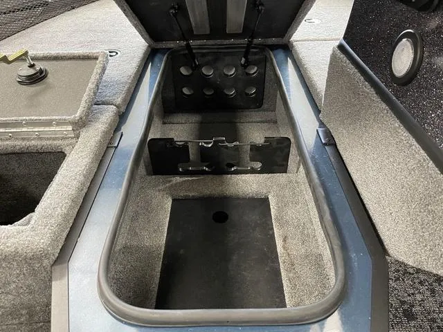 Slide: The Image of 2025 Ranger VS1782SC Angler boat storage compartment with open lid and organized interior. - 20