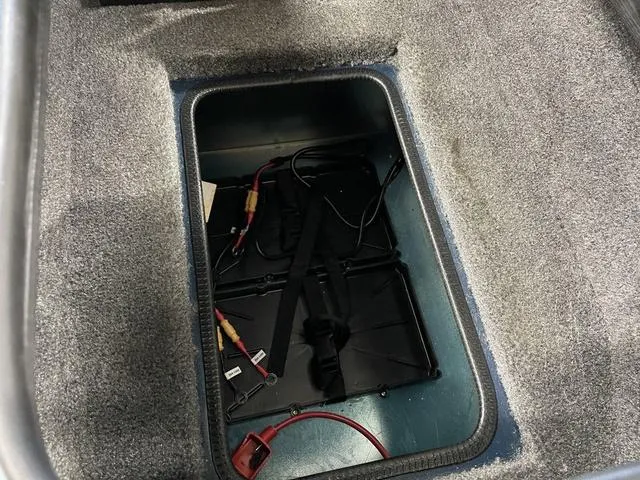 Slide: The Image of Battery compartment of 2025 Ranger VS1782SC Angler boat, featuring wiring and secure straps. - 22