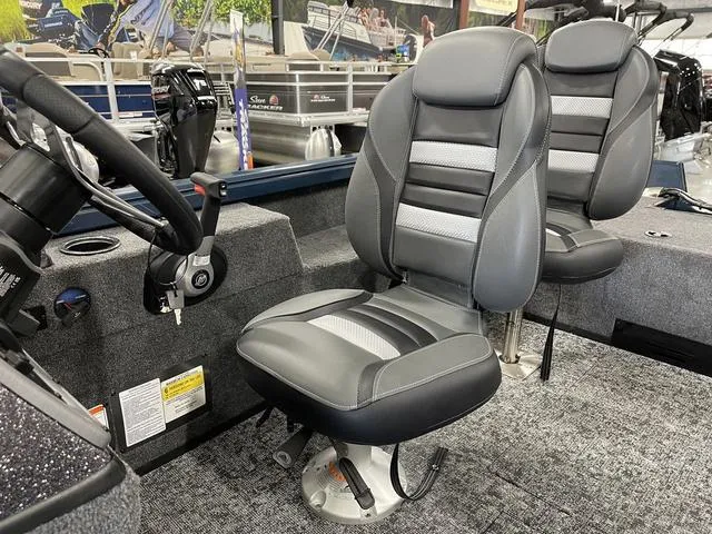 Slide: The Image of 2025 Ranger VS1782SC Angler boat interior with gray seats and steering wheel. - 23