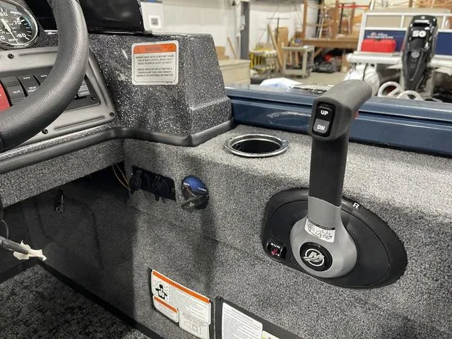 Slide: The Image of Interior of 2025 Ranger VS1782SC Angler boat showing control lever and dashboard details. - 25