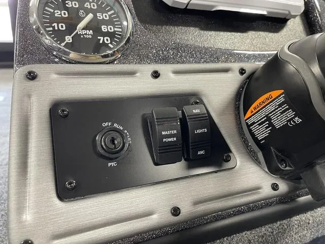 Slide: The Image of Control panel of 2025 Ranger VS1782SC Angler boat with switches and RPM gauge. - 29