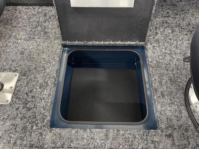 Slide: The Image of 2025 Ranger VS1782SC Angler boat storage compartment with textured flooring. - 30