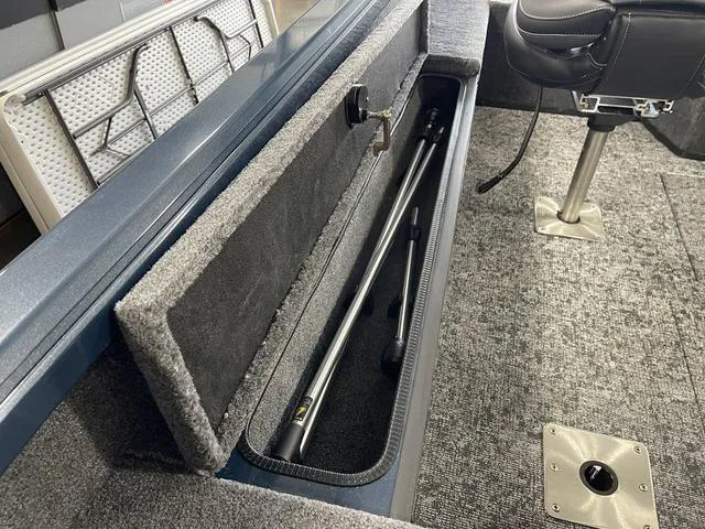 Slide: The Image of 2025 Ranger VS1782SC Angler boat interior with rod storage compartment and seating. - 35