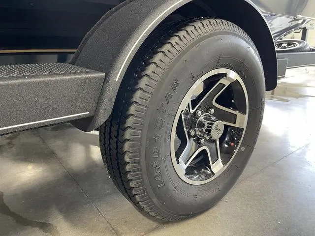 Slide: The Image of 2025 Ranger VS1782SC Angler trailer tire and wheel detail in a showroom. - 4