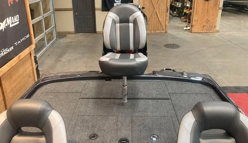 Slide: The Image of 2025 Nitro Z21 XL boat interior with gray seating and carpeted deck. - 10