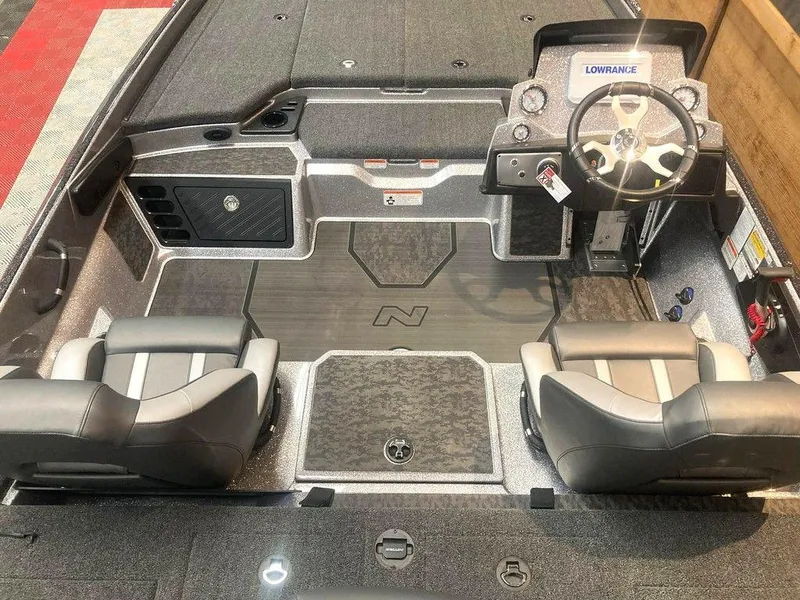 Slide: The Image of 2025 Nitro Z21 XL boat interior with dual seats and steering console. - 6