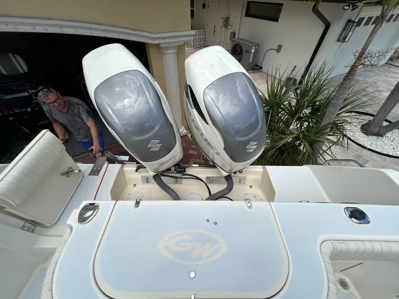 Slide: The Image of 2002 Grady-White 306 Bimini boat with dual outboard engines, viewed from above. - 13
