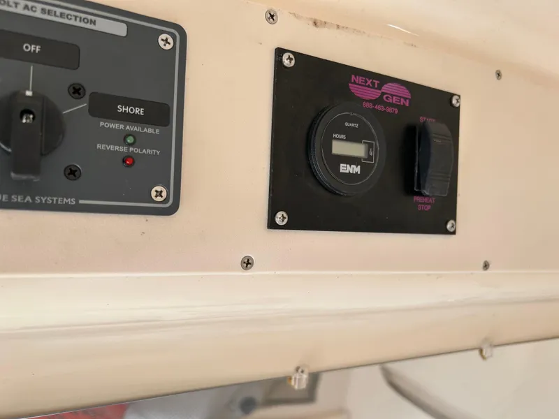 Slide: The Image of Control panel on a 2002 Grady-White 306 Bimini boat, featuring Next Gen systems. - 21
