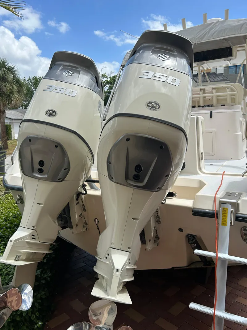Slide: The Image of 2002 Grady-White 306 Bimini boat with twin 350 horsepower engines. - 24