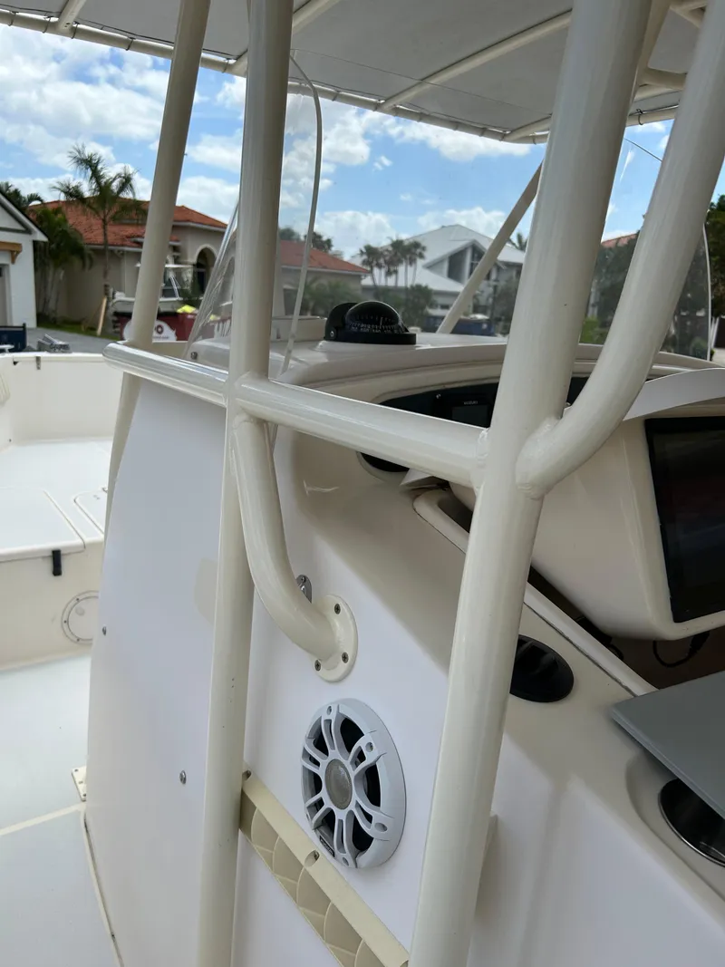 Slide: The Image of 2002 Grady-White 306 Bimini boat interior with speaker and console details. - 31