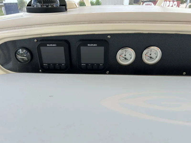 Slide: The Image of Dashboard of 2002 Grady-White 306 Bimini boat with Suzuki gauges and controls. - 35