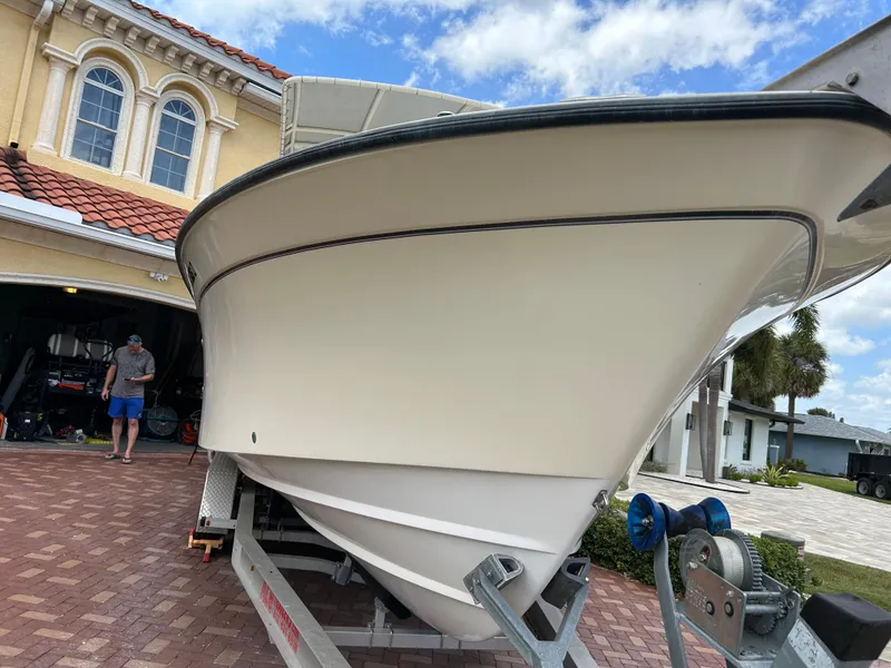Slide: The Image of 2002 Grady-White 306 Bimini boat on trailer, parked in driveway. - 4