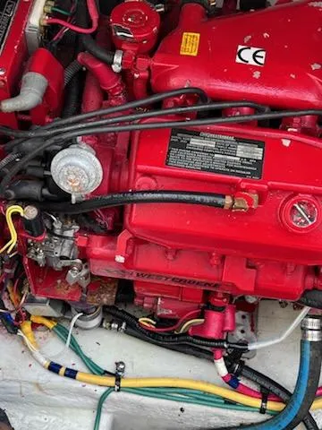 Slide: The Image of Engine of 2007 Chris-Craft Corsair 36 boat, featuring red components and visible wiring. - 13