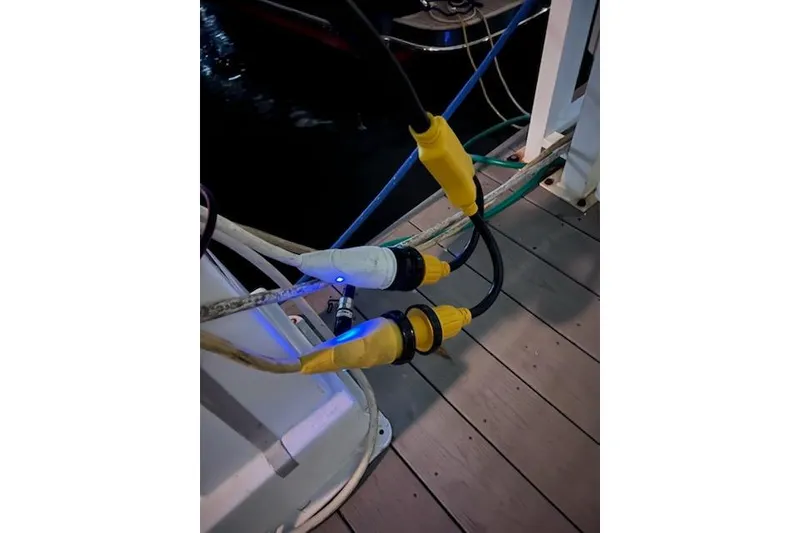 Slide: The Image of Power cables connected on a dock near a 2007 Chris-Craft Corsair 36 boat. - 20