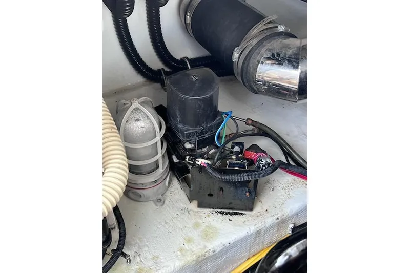 Slide: The Image of Engine compartment of 2007 Chris-Craft Corsair 36 with visible wiring and components. - 24
