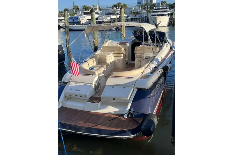 Slide: The Image of 2007 Chris-Craft Corsair 36 luxury yacht docked in marina, rear view. - 5