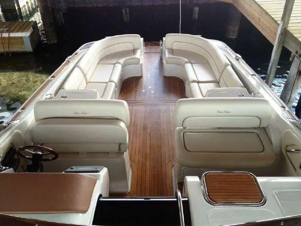Slide: The Image of Luxurious 2007 Chris-Craft Corsair 36 boat interior with elegant seating and wooden deck. - 7