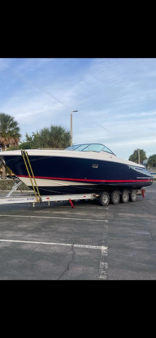 Slide: The Image of 2007 Chris-Craft Corsair 36 boat on trailer, parked outdoors. - 8